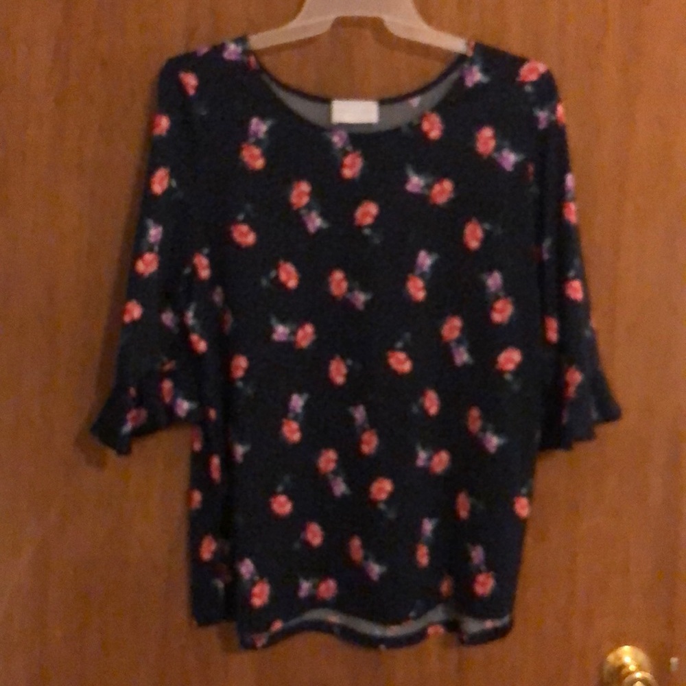 Navy and floral silky blouse.
